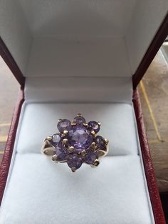 Very pretty 😍  Fully hallmarked 9ct Gold  Set withnl genuine Amethyst stones  A little rubbing on the centre stone under magnification ( the piece is 50 years old) 2.9g Size L.5 UK  Size 6 USA Gold Amethyst Ring, Amethyst Stones, Amethyst Cluster, Multi Stone Ring, Amethyst Stone, Multi Stone, Gold Set, Amethyst Ring, Cluster Ring