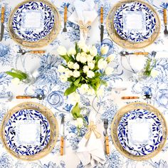 the table is set with blue and white china