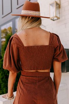 The most darling fall piece, our cute brown 'Country Lane' top features lightweight corduroy material, a straight neckline and upper back, a smocked back, puff half sleeves, and a flattering silhouette that ends in a straight hemline! Measurements S : Bust 30", Length 15", Sleeve Length 11.5", Waist 28". M : Bust 32", Length 15.5", Sleeve Length 12", Waist 30". L : Bust 34", Length 16", Sleeve Length 12.5", Waist 32". Brown Square Neck Top For Spring, Fitted Brown Smocked Top With Smocked Back, Fitted Brown Top With Smocked Bodice, Fitted Brown Tops With Smocked Bodice, Fitted Brown Top With Smocked Back, Fitted Brown Tops With Smocked Back, Brown Cotton Puff Sleeve Tops, Corduroy Top, Country Lane