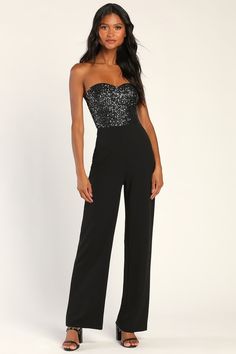 No matter the occasion, you'll be owning the night when you step out in the Lulus Total Hottie Black Sequin Strapless Jumpsuit! This show-stopping jumpsuit features glittering gunmetal grey sequins that cover the darted bodice with a strapless sweetheart neckline (supported by hidden no slip-strips). Crepe knit shapes a high, banded waist atop straight-legs that end at ankle-grazing hems. Hidden back zipper/clasp. Fit: This garment fits true to size. Length: Ankle length. Size medium measures 53 Shoes For Wedding Guest, Glitter Jumpsuit, Sparkly Jumpsuit, Jumpsuit For Wedding Guest, Vegas Outfit, Strapless Bustier, Two Piece Jumpsuit, Strapless Sweetheart Neckline, Sequin Jumpsuit