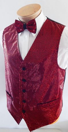 Shinny Sequin On Black Satin Vest With An Adjustable Full Back. The Vest Comes Fully Lined With Five Buttons Up, Two Outside Pockets And a Matching Sequin Bow Tie With A Matching Satin Knot (Tie Measures 21/2 by 41/2 Inches. This Vest Set Is A Real Show Stopper Red Fitted Party Vest, Red Fitted Vest For Party, Red Sleeveless Party Vest, Sequin Bow Tie, Sequin Suit, Circus Outfits, Vest And Bow Tie, Men Vest, Sequin Vest