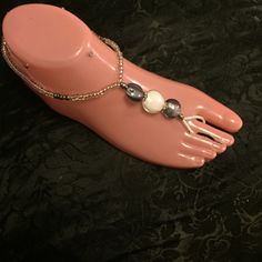 A Pair Of Silver Swirls Barefoots Women's Size 9. Silver, Gray And Clear Glass Beads. A Beautiful Accessory For Many Ocassions, A Day At The Beach, A Wedding, Dressing Up Your Pumps Or Accessorizing An Outfit For An Intimate Evening. Silver Barefoot Sandals With Ankle Strap, Silver Ankle Strap Barefoot Sandals As Gift, Elegant Silver Beaded Barefoot Sandals, Silver Beaded Barefoot Sandals For Party, Silver Ankle Wrap Barefoot Sandals For Party, Silver Ankle Wrap Sandals For Party, Elegant Handmade Silver Barefoot Sandals, Silver Beaded Anklets For Summer, Silver Beaded Anklets For Festival