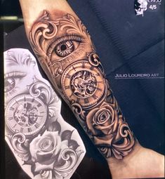 the arm is decorated with intricate tattoos and an eye