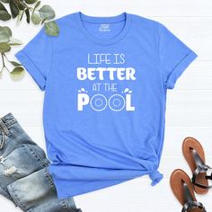 "Life Is Better at the Pool Shirt, Funny Pool T-Shirt, Vacation Shirt, Weekend Shirt, Holiday Shirt, Beach Summer Shirt, Women's Pool Shirt. HI! Welcome to my store, I'm delighted to see you here. My store's main goal is to provide you with premium everyday apparel with the best graphic t-shirts. I see you as a friend, not just a customer. I'm sure you'll love my designs. You can order the same design 4XL and 5XL large sizes from the link, please specify the details in the order note.   https:// Lifeguard Shirt, Swim Clothes, Pool Shirts, Custom Pools, Pool Time, Swimming Outfit, Holiday Shirt, Vacation Shirts, Nursing Shirts