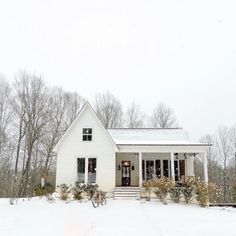 a white house with snow on the ground