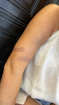 a woman with a tattoo on her arm