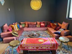 a living room filled with lots of colorful furniture