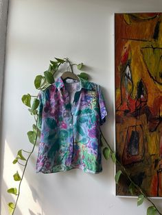 "Fauvism inspired, floral print, button up shirt Measurements: - Bust: 41\" - Waist: 40\" - Hips: 42\" Sourced: Amsterdam, Netherlands" Multicolor Floral Print Relaxed Fit Camp Shirt, Spring Green Blouse With Camp Collar, Green Camp Collar Blouse For Spring, Fitted Spring Hawaiian Button-up Shirt, Fitted Hawaiian Button-up Shirt For Spring, Fitted Button-up Hawaiian Shirt For Spring, Spring Multicolor Hawaiian Shirt With Camp Collar, Fitted Printed Hawaiian Shirt For Spring, Multicolor Hawaiian Shirt With Camp Collar For Spring