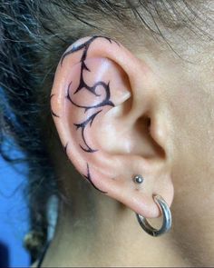 an ear with black and white designs on it