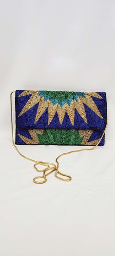 fine handcrafted beaded bag. please note this is beaded on all sides. hand made. blue green and gold. the perfect party bag!! available in two colorways black and blue. stunning craftmanship. large clutch with chain strap can be worn cross body or hand held. size 7x11 inches Fancy Clutch Purse, Peacock Purse, Fancy Clutch, Beaded Clutch Purse, South Gate, Large Clutch, Party Clutch, Bag Diy, Beaded Bag