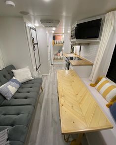 a living room and kitchen in a tiny home