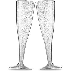 two champagne flutes with glitter on the top and bottom are shown in black and white