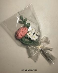 a bouquet of flowers is wrapped in plastic