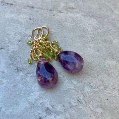 Beautiful one-of-a-kind earrings for every occasion Big Raw Amethyst Teardrop stone (it is not Quartz so is not clear or perfectly symmetrical) These earrings are not delicate  Tiny peridot beads compliment the amethyst Cluster Earrings, dangle, and drop earrings Unique gift for anyone Comes in a Gift Box Elegant Amethyst Earrings With Natural Stones, Amethyst Dangle Earrings With Natural Stones, Purple Natural Stones Drop Earrings, Faceted Amethyst Drop Earrings, Amethyst And Peridot, Amethyst Multi-stone Drop Earrings, Raw Amethyst, Amethyst Cluster, Earrings Unique