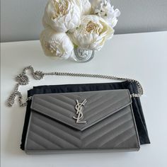 Nib Saint Laurent Monogram Quilted Leather Chain Wallet / Large Size. Comes With Box, Dust Bag And Inserts. In Like New Condition 10/10. Used 3-4 Times, Kept In Pristine Condition. Bag Color Is Grey With Silver Hardware Elegant Monogram Shoulder Bag, Elegant Monogram Wallet For Formal Occasions, Ysl Envelope Bag, Ysl Camera Bag, Ysl Cosmetics, Ysl Wallet On Chain, Monogram Quilt, Dream Bags, Saint Laurent Bags