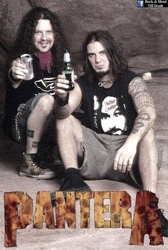 two men sitting next to each other with beer bottles in their hands and the words panther on them