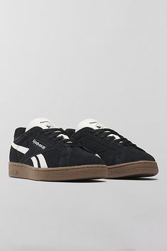 Reebok Club C Grounds UK sneakers. Reebok's iconic Club Cs with an '80s vintage feel, the Club C Grounds UK sneakers have a soft suede upper with smooth side stripes and heel tab. Features Reebok Club C Grounds UK sneakers '80s aesthetic sneakers in soft suede Lace-up style Content + Care Suede, rubber Spot clean Imported | Reebok Club C Grounds UK Sneaker in Black/Chalk/Gum, Women's at Urban Outfitters Stray Logan Shoes, Black Sneakers Platform, Black Tennis Shoe, Cute Black Sneakers For Women, Black Suede Sneakers, Black Shoes Sneakers Women, Black Sneakers Aesthetic, Womens Black Shoes, 80s Sneakers