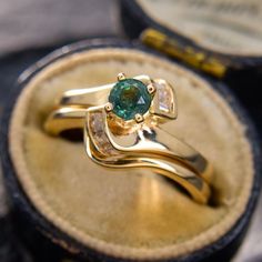 a close up of a ring in a box