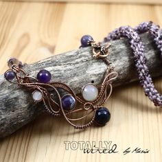 "BERRY PATCH Amethyst in oxidized antiqued copper wire.  Handmade vintage style necklace. Amethyst wrapped in antiqued copper wire and finished with a hand-made beaded kumihimo cord and floral toggle clasp.  The focal measures 3 1/4\" x 1 3/4\" (8.3 x 4.4 cm). The total length is around 23 1/4\" (extension may be added upon request). Thank you!" Unique Purple Copper Necklace, Bohemian Purple Hand Forged Necklace, Handmade Purple Necklace With Copper Wire, Handmade Purple Copper Wire Necklace, Artisan Purple Wire Wrapped Necklace, Hand Wrapped Purple Copper Necklace, Purple Wire Wrapped Copper Wire Necklace, Kumihimo Cord, Beaded Kumihimo