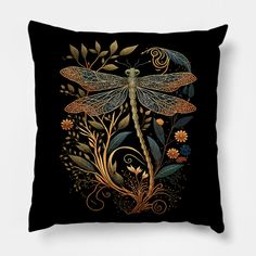 a black pillow with a dragon on it's back and flowers in the background