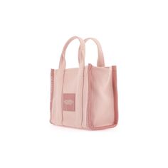 The Jacquard Small Tote Bag by Marc Jacobs in cotton-blend canvas, featuring double top handle, adjustable and removable shoulder strap, front contrasting jacquard logo, rear fabric logo patch, zip closure and side handle. Unlined interior with a fabric open flat pocket. Silver-finished metalware.