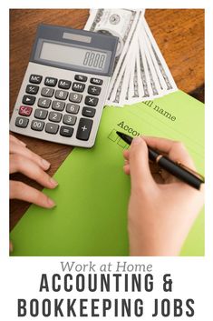 a person writing on a piece of paper next to a calculator and pen