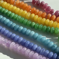 "Planning to knot with Size 8 Griffin silk? These beads are perfect for all knotting and finishing techniques!  These 8mm smooth rondelles are made of Quartz and dyed to get these deliciously vibrant colors. These beads have an ultrasonically drilled 1mm hole, so they're easy to string, even on stretch bracelets, memory wire, leather and heavier cording. Details: Stone: Natural Quartz / Quartzite (See Gem Geek Notes for More) Strand Length: Approximately 15\" Shape: Rondelle Features: Smooth / Plain  Treatment: Dyed Bead Snob Notes: Cord Sizing: Plan to use a minimum of a Size 6 - although I think a 7 or 8 will be best. Beading Wire: My vote would be for a \"medium\" Soft Flex or Soft Touch. Gauged Wire: I'd vote for a 22 gauge, but a 20 or even an 18 could work. Gem Geek Notes: I'm of the Rainbow Spacer Beads For Jewelry Making, Rainbow Spacer Beads, 8mm Rondelle Beads For Jewelry Making, Adjustable Gemstone Round Beads, Rainbow Polished Beads For Jewelry Making, Cute Storage Boxes, Ombre Necklace, Bracelets Patterns, Rainbow Gemstones