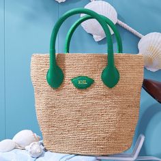 Inspired by a recent trip to Italy, the Mia Handbag is a beautiful bag for summer days, wedding celebrations or any time you need a touch of luxury. Its beauty is in its simplicity: handwoven raffia meets soft and supple Italian leather. This unlined open tote instantly evokes long summer days on the Italian countryside. Add a foil debossed monogram for a personal touch.    7.5"w (bottom), 13.5"w (top) x 4.75"d x 10"h  Handle drop: 4"  Handwoven raffia, Italian leather.  Clean with a soft cloth.  Made in Italy.  Monogramming is foil debossed. Luxury Bag With Rolled Handles In Natural Color, Luxury Straw Bags For Everyday, High-end Straw Bags, Luxury Straw Bag With Rolled Handles For Daily Use, Elegant Handwoven Bucket Bag For Travel, Elegant Handwoven Travel Bucket Bag, Luxury Vacation Shoulder Bag With Rolled Handles, Luxury Crochet Bag With Braided Handles In Natural Color, Elegant Natural Woven Leather Bag