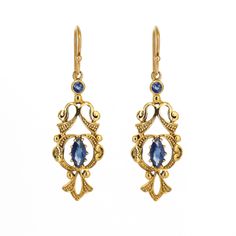 Natural Blue Sapphire Gemstone Earrings in 9k Solid Yellow Gold, One of a kind Yellow Gold Jewellery, Gold Filigree Earrings Product Details > Gemstone - Natural Blue Sapphire > Materials - 9k Solid Yellow Gold > Gemstone Shape - Marquise & Round Cut > Earring Length : 39mm length Approx > Earring Width : 12mm Approx > Gross Weight - 3.800 grams Approx > Setting type - Prong, bezel setting *Production Time: This is one of a kind unique piece, it's possible to make the same style again but not po Ornate Blue Earrings For Formal Occasions, Ornate Blue Earrings For Formal Events, Gold Filigree Earrings, Victorian Pendants, Blue Sapphire Gemstone, Headpiece Jewelry, Gold Jewelry Sets, Platinum Jewelry, Roxy Women