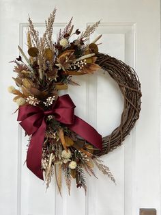 a wreath is hanging on the front door