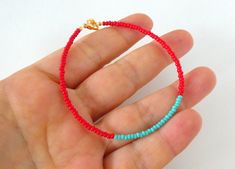 "You know how sometimes you need a pop of red on your outfit and can't find the perfect accessory? This is the answer to your never ending quest. This dainty and delicate bracelet is made with a lovely red and turquoise seed bead combination. Read the reviews below from happy customers and get one for yourself before it's too late. ❤SIZES This item comes in several sizes, kindly choose at checkout. The standard size for an average woman is 7\". For a child, perhaps a 6\" would be appropriate. If Red Colorful Beaded Bracelets For Everyday, Dainty Red Beaded Bracelets For Everyday, Dainty Red Beaded Bracelets With Tiny Beads, Trendy Red Beaded Bracelets With Tiny Beads, Red Beaded Bracelets For Everyday Wear, Red Bracelet Jewelry For Summer, Red Summer Bracelet Jewelry, Trendy Red Beaded Bracelets With Colorful Beads, Red Beaded Dainty Bracelets