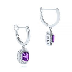 106052 14k White Gold Earrings   Amethyst - 1.30 ctw   Octagon    32 Diamonds - .11 ctw    Clarity: SI, Color: H-I. These lovely earrings feature step cut amethyst gems surrounded by modified halos of round and baguette diamonds in an octagon shape. Formal Dangle Hoop Earrings With Gemstones, White Gold Dangle Diamond Earrings With Gemstones, White Gold Diamond Dangle Earrings With Gemstones, Formal Octagon Earrings With Diamond Accents, Fine Jewelry Amethyst Earrings With Prong Setting, White Gold Amethyst Earrings Fine Jewelry, Formal Octagon Gemstone Earrings, Classic Octagon Amethyst Jewelry, Fine Jewelry Purple Octagon Shaped