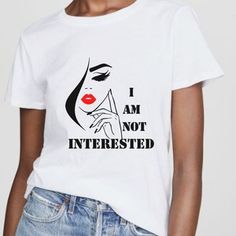 a woman wearing a white t - shirt with the words i am not interested on it