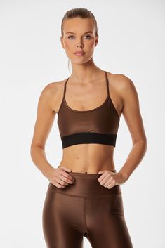 Supportive, sporty, and stylish - meet the Liquid Studio Bra. A scoop neckline and sporty elastic back create the perfect balance between chic and athletic. Now available in Cafe, a beautiful mid-tone brown gloss. Sporty Brown Yoga Activewear, Micro-elastic Athleisure Sports Bra, Sleek Yoga Activewear With Built-in Bra, Brown Stretch Activewear, Short Length, Micro-elastic Sweat Resistant Sports Bra For Yoga, Scoop Neckline, Elastic, Bra, Cafe