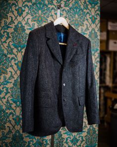 "ABOUT THIS STYLE: A three button jacket with a high break point, a 1920s style swoosh breast pocket and butcher's buttons made from beautiful buffalo horn.  A classic pleated pant with a tapered leg and a watch pocket. This style features handmade Milanese style silk buttonholes. Classic flap pockets and a piping ticket pocket complete the look. English woven Shetland tweed from Yorkshire.  A robust fabric that is just the same as it would have been in the 19th and early 20th century.  Woven to last a lifetime with an incredible richness of color in the weave.   Edwardian, vintage style, retro----this style has a wealth of the amazing classic details that are rarely seen on store bought menswear: As always, a client can choose every detail from dozens of cuff styles to the placket shape a Classic Black Tweed Jacket With Button Closure, Classic Black Tweed Jacket With Buttons, Classic Black Tweed Blazer, Winter Tweed Three-piece Suit For Work, Tailored Timeless Tweed Jacket With Pockets, Timeless Tweed Suit With Welt Pockets, Classic Tweed Suits With Pockets, Classic Black Tweed Jacket With Pockets, Classic Tweed Suits With Suit Collar