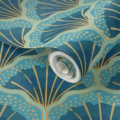 a blue and gold wallpaper with an abstract design on it's surface,