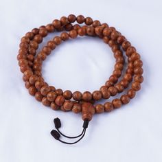 Material: Bodhi seed/ Phoenix eye Size of each Bodhi seed bead: 12 mm Size of Guru Bead: 15 mm There are  108 bodhi seed beads Length of Prayer Bead: 22 inches when measured at 90 degree The string is brown in color with an adjustable knot Weight of the mala: 120 gram Handmade in Nepal The Bodhi seed is commonly called the wisdom tree, and each seed is said to bear the fruits of knowledge for all beings. It is used for spiritual promise, dedication, and faith. Bodhi seed beads can count all mantras and other prayers, prostrations, circumambulations, etc. It is the bestower of knowledge and the remover of obstacles, too. Holistic Mala With Round Beads For Festival, Traditional Hand Knotted Necklaces For Festivals, Traditional Beaded Bracelets For Meditation With 108 Beads, Traditional Brown Beaded Bracelets For Rituals, Adjustable Holistic Beads For Festivals, Holistic Mala For Festival With Round Beads, Traditional Polished Beaded Necklaces For Meditation, Festival Hand Knotted Beaded Necklace With Round Beads, Traditional Beaded Bracelets For Healing And Festivals