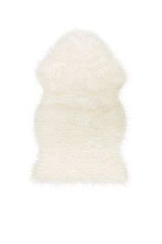 a white fur pillow on a white background