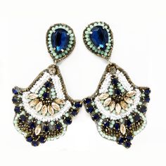 The Feel Like Flirting Statement Earring has a fun flare to them. They are ready for any party or event. The colors are stunning together: blue, white, gold and sea-foam green. Handmade Hypoallergenic Posts Length: 3.75" Width: 2" Post Back Satin Lining Rhinestone & Bead Detailing Jeweled Dangle Beaded Earrings For Party, Bohemian Blue Earrings For Party, Blue Rhinestone Drop Earrings, Blue Crystal Earrings For Party, Blue Drop Earrings For Bridal Celebration, Handmade Blue Crystal Earrings For Party, Glamorous Blue Chandelier Earrings For Party, Blue Drop Bridal Earrings For Celebration, Turquoise Drop Crystal Earrings For Party