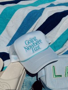 In collaboration with Aubrey! Going nowhere fast - white foam trucker with baby blue embroidery + rope! Whether you are on the boat, at the pool, or laying on the beach, this is the perfect hat for all summer wear! Ships immediately unless on preorder! Blue Adjustable Trucker Hat For Summer, Summer Trucker Hat In Blue For Travel, Adjustable Blue Trucker Hat For Summer, White Travel Hat For Beach Season, White Hat For Beach Season Travel, Trendy Summer Trucker Hat For Travel, Blue Curved Brim Trucker Hat For Summer, Blue Snapback Trucker Hat For Summer, Trendy Trucker Hat For Summer Travel