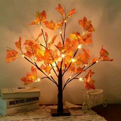 a lighted tree is sitting on a table