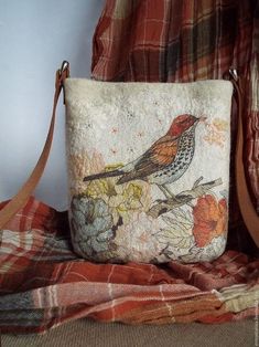 a small purse with a bird on it