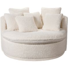 a white round couch with pillows on it's back and sides, in front of a white background