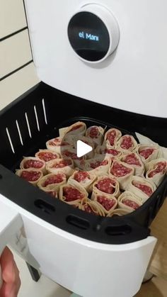 the food is being prepared in the machine to be made into rolls or pizzas