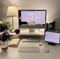 a desktop computer sitting on top of a white desk