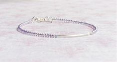 This beautiful dainty bracelet is handmade with transparent lavender purple AB Japanese seed beads, sterling silver tube bead, and sterling silver findings (the heart charm is silver plated). The bracelet fastens with sterling silver lobster clasp. You can choose the length of your bracelet before putting it in the cart. More bracelets - https://www.etsy.com/shop/SentimentoShop?section_id=13605661&ref=shopsection_leftnav_2 Please contact me if you have any questions. Thank you for looking and have a great day! Please note: actual color shade may vary from picture due to computer settings. Elegant Purple Beaded Bracelets With Tiny Beads, Handmade Minimalist Purple Bracelets, Minimalist Handmade Purple Bracelets, Handmade Minimalist Purple Bracelet, Purple Minimalist Handmade Bracelet, Purple Seed Bead Bracelet, Small Beads Bracelet, Stacked Beaded Bracelets, Small Bead Bracelet