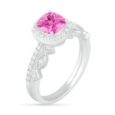 Proclaim your love in sophisticated style with this gorgeous gemstone and diamond bridal set. Crafted in cool 10K white gold, the elegant engagement ring showcases a 6.0mm cushion-cut lab-created bright pink sapphire wrapped in a frame of and atop a slender shank lined with sparkling petite diamonds. On your wedding day, complete her look with the coordinating art deco-inspired band adorned with a row of shimmering diamond-touched marquise and tilted-square shapes. Radiant with 1/4 ct. t.w. of d Dazzling White Gold Bridal Sets With Cubic Zirconia, Promise Ring Bridal Sets With Diamond Accents And Moissanite, Moissanite Bridal Sets With Diamond Accents For Promise, Elegant White Gold Cubic Zirconia Bridal Set, Wedding 14k White Gold Diamond Ring With Accent Stones, Cubic Zirconia Bridal Sets For Promise, Fine Jewelry Cubic Zirconia Bridal Sets For Promise, Diamond Bridal Sets With Accent Stones For Promise, Heart Cut Lab Grown Diamond Wedding Ring