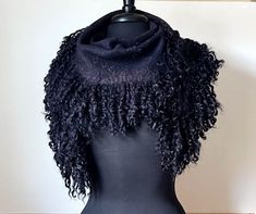 "Beautiful Felted Scarf-Kerchief with Wensleydale Locks. Dark Graphite Color Felted Scarf will decorate your Image. You can drape around the neck or choose another wearing option. Unique Fashion Accessory.  Ready to Ship. Dark Graphite Color Felted Scarf with Black Wensleydale Locks. Soft and Warm. 100% Handmade. Hand Dyeing. Safe dyes comply with Oeko-Tex Standard 100. Materials :  Extra fine Merino Wool, Wensleydale Fleece Sheep Locks, Silk Fibers Measures:  165 x 35 cm with Locks Care: Warm water only.  Using the washing machine is not recommended.  To iron with steam in the mode \"Wool\". Real colors may slightly differ. You can find more of my Felting scarf here https://www.etsy.com/shop/FlowDream?ref=seller-platform-mcnav&section_id=17688624 Please visit my Facebook page https://www. Felting Scarf, Merino Wool Scarf, Felted Scarf, Felted Scarves, Scarf Women, Black Sheep, Felted Wool, Wool Scarf, Warm Water