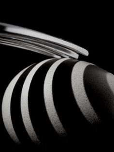 an abstract black and white photograph with curved lines