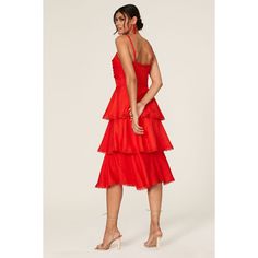 Red crepe (100% Polyester). Hourglass. Sleeveless. Sweetheart neckline with knot detail along bodice. Ruffle tiered skirt detailing. Hidden back zipper closure. 45” from should to hemline. Imported. Fitted Layered Tiered Dress For Party, Fitted Tiered Dress With Layered Hem For Party, Red Dress With Ruffled Straps For Party, Layered Spaghetti Strap Dress For Party, Elegant Layered Dresses With Ruffled Straps, Layered Spaghetti Strap Party Dress, Elegant Tiered Dress With Spaghetti Straps And Ruffle Hem, Elegant Sleeveless Tiered Dress For Party, Elegant Sleeveless Tiered Party Dress